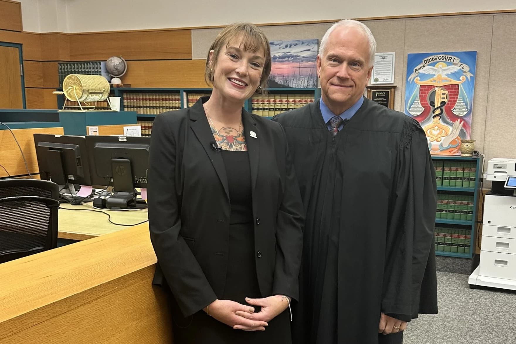 Cody Nagle standing beside a judge in the Pierce County Drug Court courtroom in Tacoma, Washington